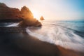 Sea Waves at Praia Dona Ana Beach with beautiful Rock formations at sunrise - Long Exposure shot - Lagos, Algarve, Portugal Royalty Free Stock Photo