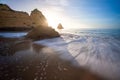 Sea Waves at Praia Dona Ana Beach with beautiful Rock formations at sunrise - Long Exposure shot - Lagos, Algarve, Portugal Royalty Free Stock Photo