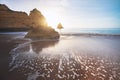 Sea Waves at Praia Dona Ana Beach with beautiful Rock formations at sunrise - Long Exposure shot - Lagos, Algarve, Portugal Royalty Free Stock Photo