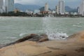 Sea waves roll over the rocks