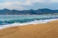 Sea Waves on Sandy Beach Texture Background, Transparent Ocean Water, Blue Sky, Sunny Shore Royalty Free Stock Photo