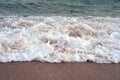 Sea waves and sandy beach