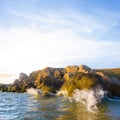 sea waves splash over rocky coast Royalty Free Stock Photo