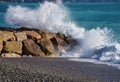 Sea waves splashing against coastal rocks detail Royalty Free Stock Photo