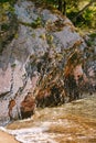 Sea waves wash over a cliff on the shore