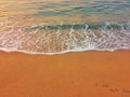 Sea waves on yellow sand beach. Royalty Free Stock Photo