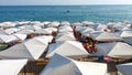 The sea with white beach umbrellas Royalty Free Stock Photo