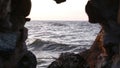 Sea through a window in a cave