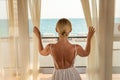 Sea window view blonde open room coast mediterranean holiday young, from luxury person from summer for adult relax Royalty Free Stock Photo