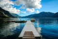 Sea and wooden platform on the seacoast and boats. Sky with amazing clouds. Royalty Free Stock Photo