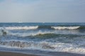 The sea is worry, waves with foam. The white ships on the horizon Royalty Free Stock Photo