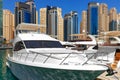 Sea yacht boat against Dubai Marina skyscrapers