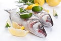 Seabass fish with hebs, limes and lemons Royalty Free Stock Photo