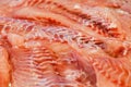 Seabass, hamour, grouper fish, sea bass fillet many sliced and piled in bulk in fish market Royalty Free Stock Photo