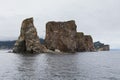 Seabird flying between eroded parts of the famous limestone PercÃÂ© Rock