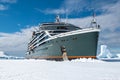 Seabourn Pusuit cruise ship breaking through sea ice in Antarctica. Royalty Free Stock Photo