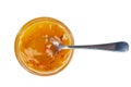 Seabuckthorn jam in glass jare with spoon isolated on a white background