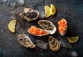 Seafood assorted starters and appetizers salmon tartare, black caviar, oysters