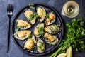 Seafood. Baked mussels with cheese and lemon in shells