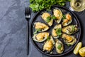 Seafood. Baked mussels with cheese and lemon in shells Royalty Free Stock Photo