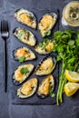 Seafood. Baked mussels with cheese and lemon in shells Royalty Free Stock Photo