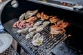 Seafood BBQ  barbecue. Collection of octopus, oysters, clam, tiger shrimps grilled on grill Royalty Free Stock Photo