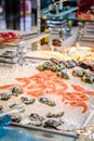 Seafood buffet on ice with oysters, shrimp, conchs and mussels