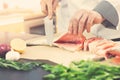 Seafood - chef prepares salmon for cooking