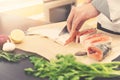 Seafood - cook slicing salmon for preparing