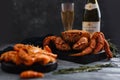 Seafood. Crab hairy close-up, in background bottle of champagne, glass, dark background