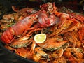 Seafood Crabs, lobster, shellfish, shrimps with lemon on grill