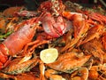 Seafood Crabs, lobster, shellfish, shrimps with lemon on grill