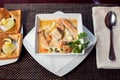 Seafood cream soup with toasts in white plate on the table. Food and restaurant concept Royalty Free Stock Photo