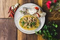 Seafood dish. Prawns cooked in spicy sauce with three pieces of bread served on white plate. Decoration of parsley