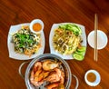 Seafood dishes on the table include fried rice, snail salad, steamed shrimp Royalty Free Stock Photo