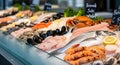 Fresh seafood display featuring a variety of fish, shellfish, and crustaceans arranged on ice with vibrant colors and textures Royalty Free Stock Photo