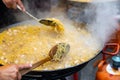 Seafood fideua in large paellera at spanish street festival Royalty Free Stock Photo