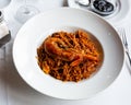 Seafood fideua with shrimps served with black garlic aioli