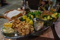 Seafood fish platter in Croatia with tuna fish Calamari and spinat potato