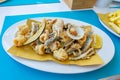 Deep fried seafood fish platter in Valun Cres island Croatia with little fishes shrimps calamari and mussels Royalty Free Stock Photo