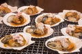 Seafood grill - street food in Tsukiji fish market, Tokyo, Japan Royalty Free Stock Photo