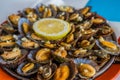 Seafood - grilled limpets served with lemon. Lapas grelhadas Royalty Free Stock Photo