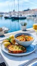 Seafood lunch with garlic bread and wine by the marina Royalty Free Stock Photo