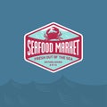 Seafood market or restaurant logo. Red Crab silhouette and blue sea wave.