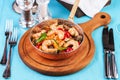Warm salad of grilled fish pieces, shrimps and mussels in a frying pan Royalty Free Stock Photo