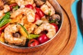 Warm salad of grilled fish pieces, shrimps and mussels in a frying pan Royalty Free Stock Photo