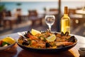 Seafood paella with a glass of wine on the table, set against a Mediterranean sea view