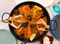 Seafood paella with lobster, mussels, calamari, shrimps