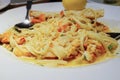 seafood pasta and bread ordered from a restraunt