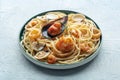 Seafood pasta plate. Spaghetti with mussels and calamari, shripms and clams